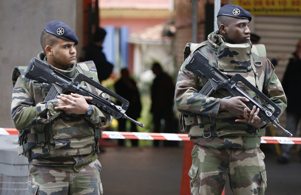 Soldiers stand guard outside a Jewish Community Center where three soldiers, patrolling outside the center as part of the country’s Vigipirate security measures, were attacked by a man with a bladed weapon, on February 3, 2015 in downtown Nice, southeastern France. (VALERY HACHE/AFP/Getty Images)